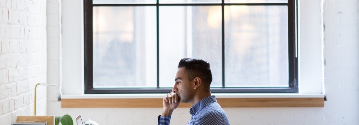 man sat at computer