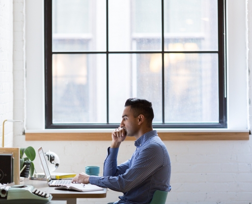 man sat at computer