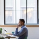 man sat at computer